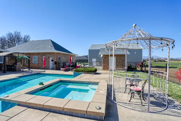 an aerial view of house with a swimming pool