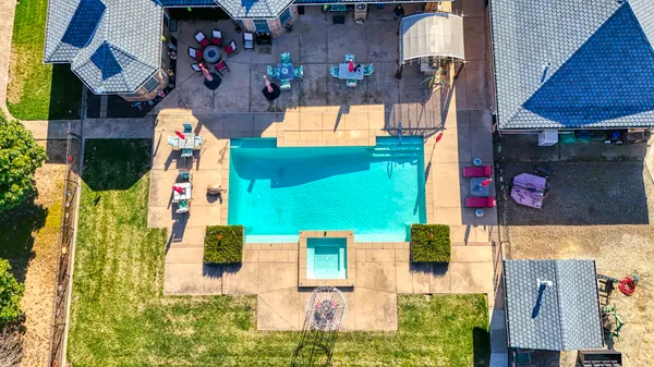 an aerial view of houses with outdoor space