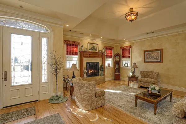 a living room with furniture and a fireplace