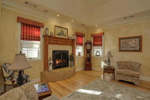 a living room with furniture and a fireplace