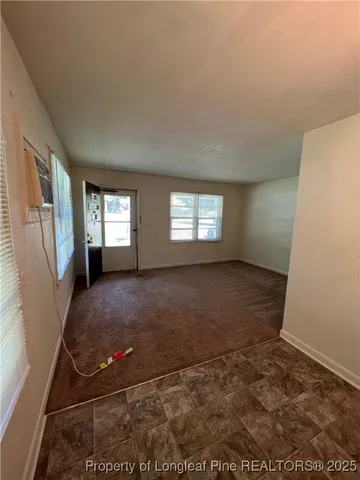 a view of a hallway with an empty room