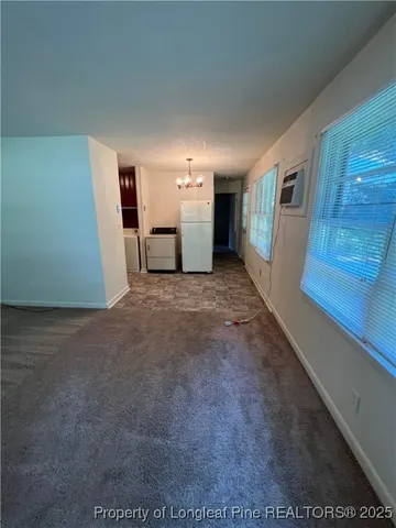 a kitchen with wooden cabinets and a sink