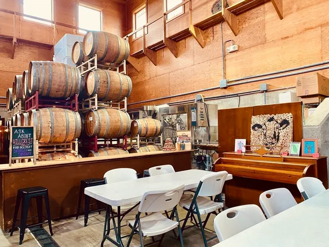 a view of a patio with table and chairs potted plants