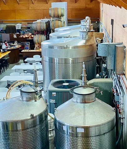 an aerial view of a swimming pool having outdoor seating