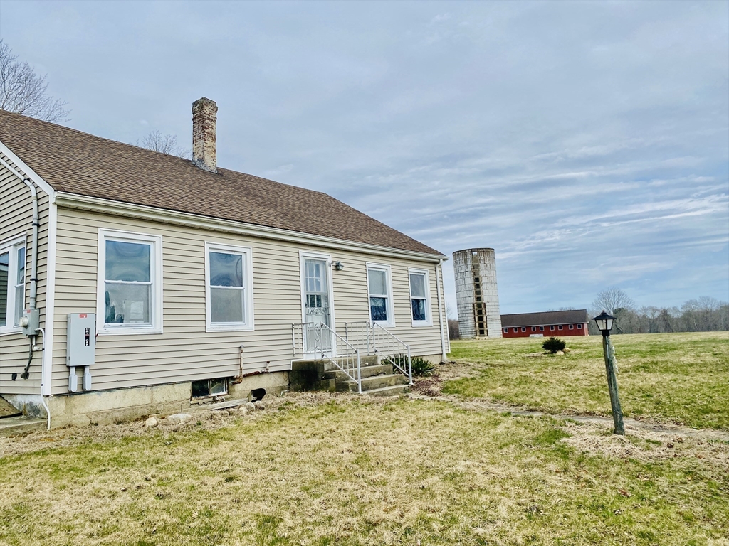 335 Old Fall River Road Dartmouth, MA 02747 - Photo 27 of 32 a front view of a house with a yard