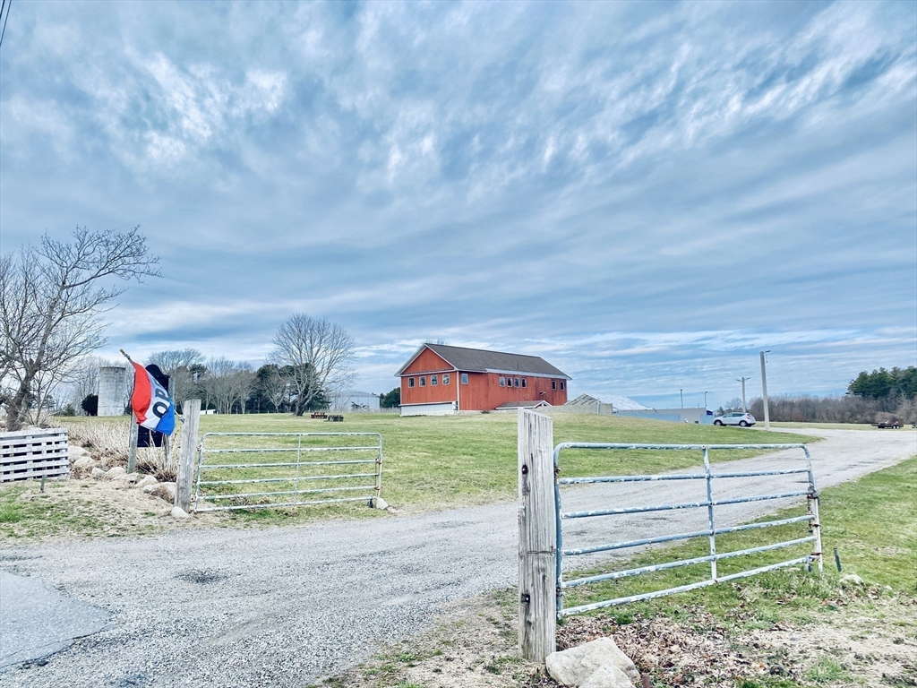 335 Old Fall River Road Dartmouth, MA 02747 - Photo 7 of 32 a front view of a house with garden