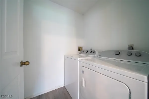 a utility room with dryer and washer