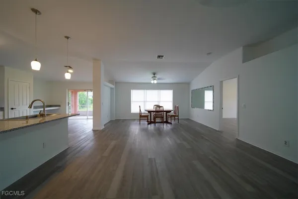 a view of a kitchen and dining room