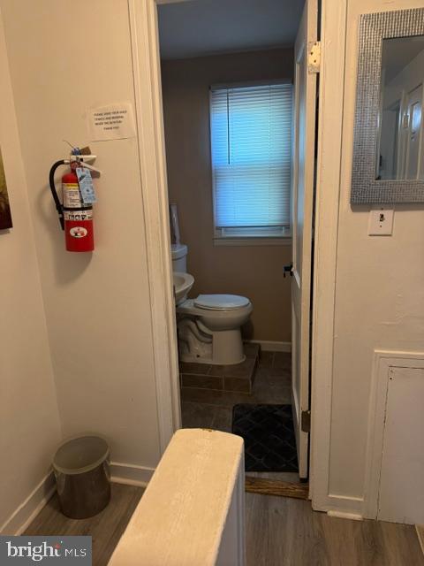 4603 Raleigh Road Temple Hills, MD 20748 - Photo 38 of 40 a bathroom with a toilet and a shower curtain