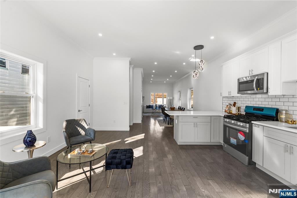 784 Valley Street Union, NJ 07088 - Photo 11 of 49 a open kitchen with sink cabinets and wooden floor