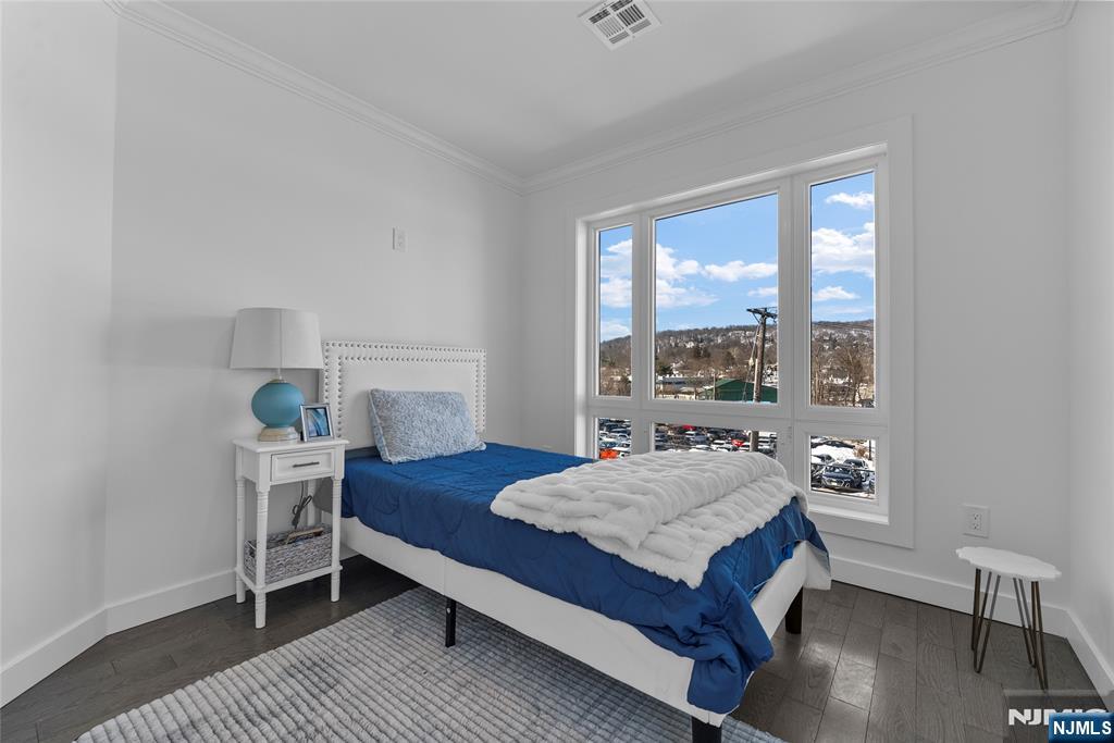 784 Valley Street Union, NJ 07088 - Photo 30 of 49 a bedroom with a bed and a window