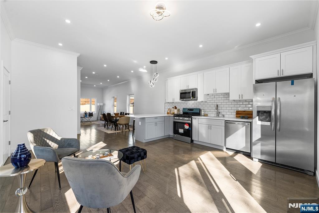 784 Valley Street Union, NJ 07088 - Photo 10 of 49 a kitchen with a refrigerator and white cabinets