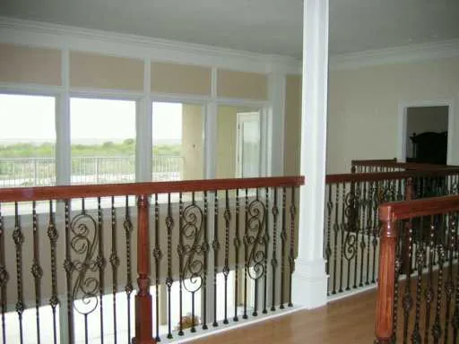 a view of a refrigerator in an empty room