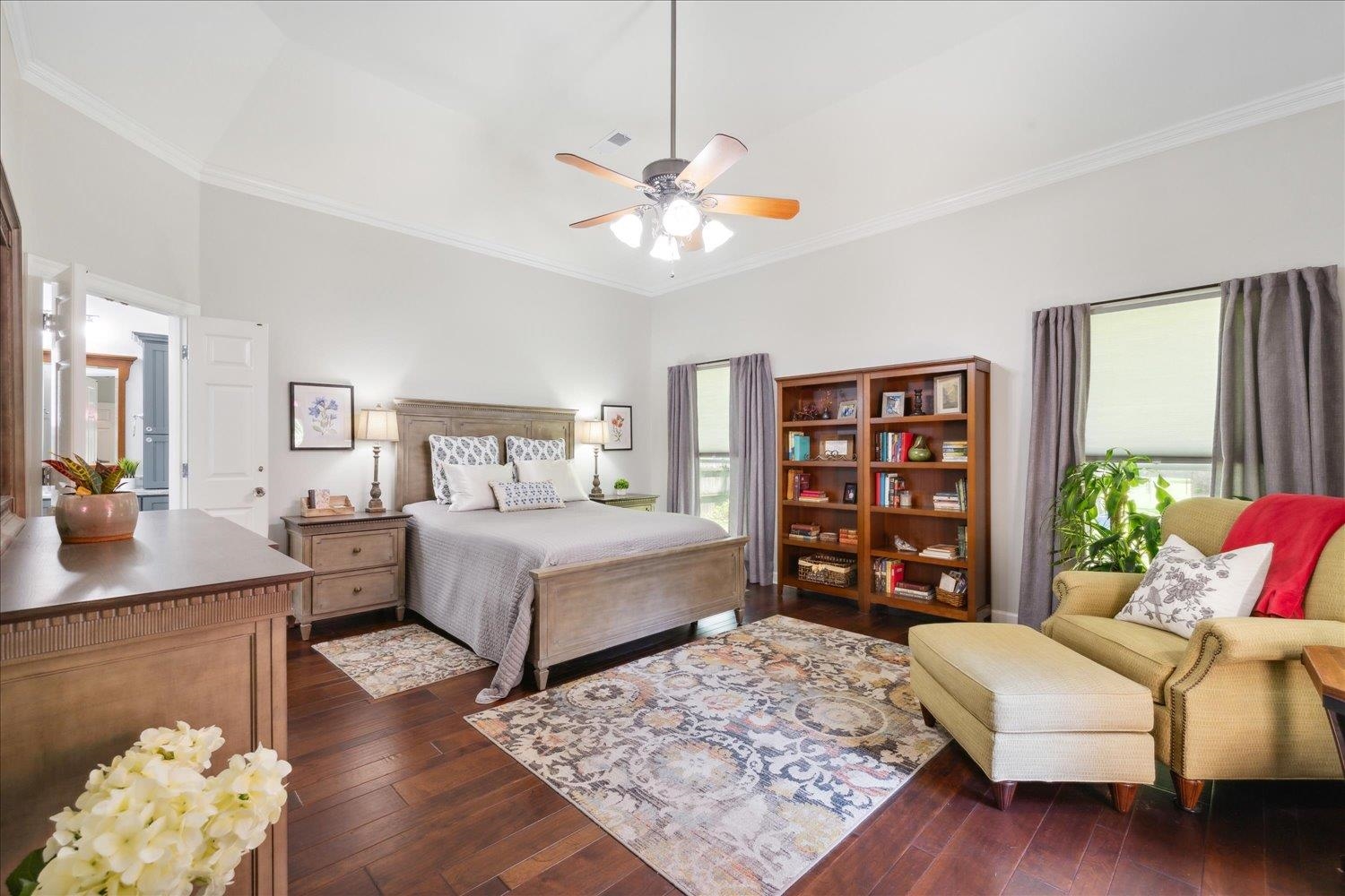 7051 7th Road Bartlett, TN 38135 - Photo 3 of 37 Spacious primary bedroom with tray ceilings and an exit directly onto the deck.
