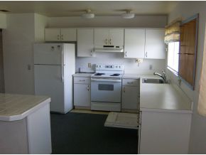 1354 Ne Port Palm Bay, FL 32905 - Photo 3 of 7 a kitchen with a sink a stove and refrigerator