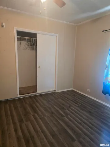 a white toilet sitting next to a shower curtain