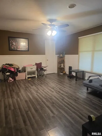 an empty room with wooden floor