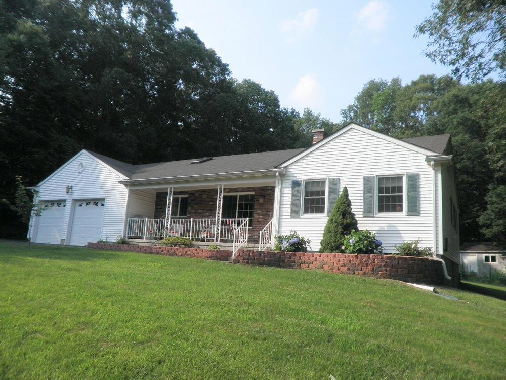 90 Newent Road Lisbon, CT 06351 - Photo 1 of 1 a front view of a house with a yard and porch