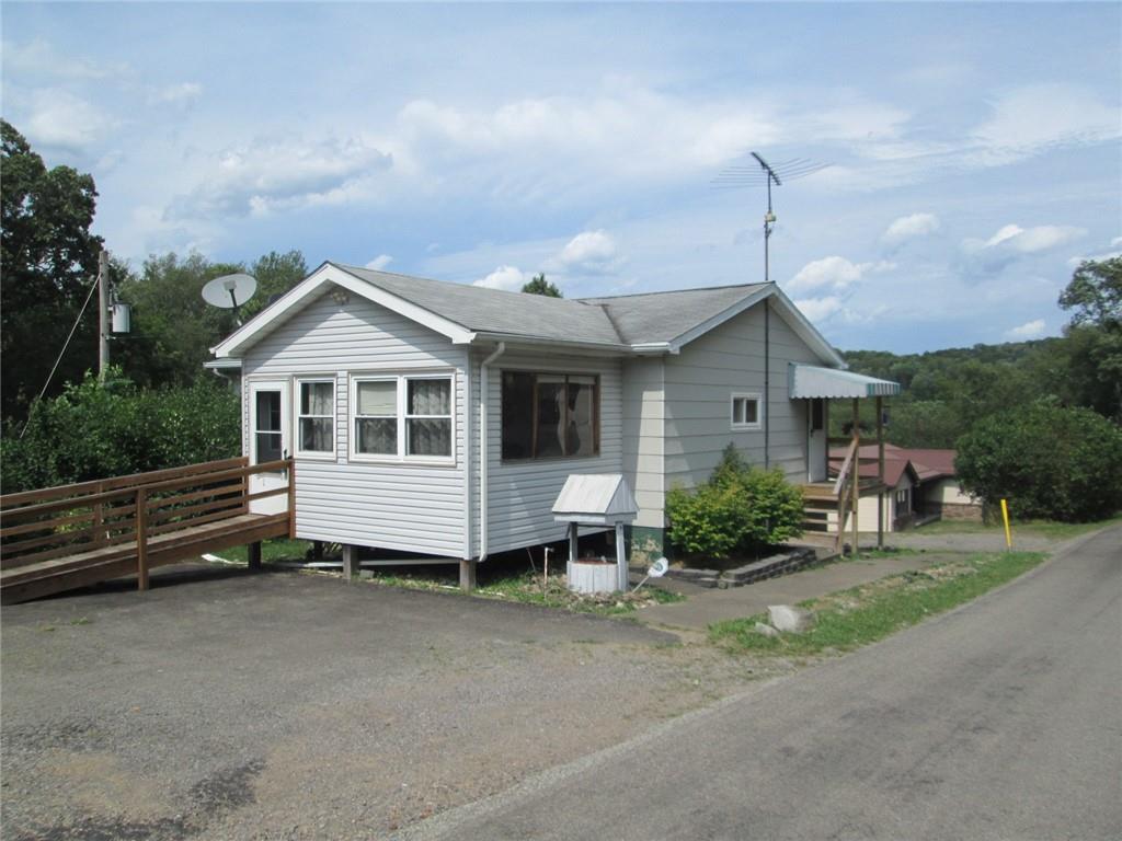 1075 Red Mill Road Kittanning, PA 16201 - Photo 1 of 18 a front view of a house with a yard