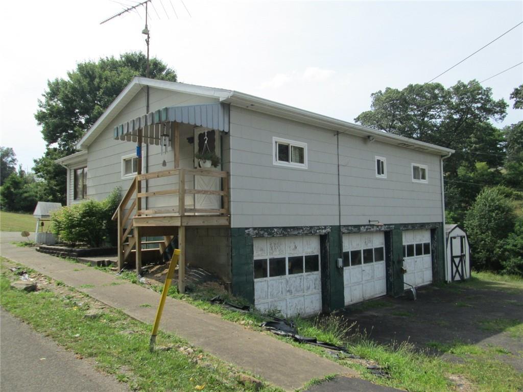 1075 Red Mill Road Kittanning, PA 16201 - Photo 2 of 18 a front view of a house with a yard