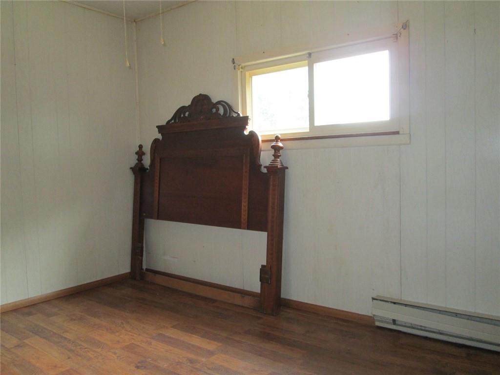 1075 Red Mill Road Kittanning, PA 16201 - Photo 10 of 18 an empty room with wooden floor and windows