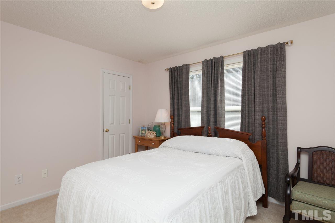 333 West Watson Road Benson, NC 27504 - Photo 11 of 25 a bedroom with a bed and a window