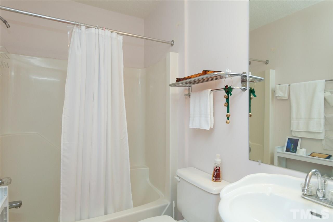 333 West Watson Road Benson, NC 27504 - Photo 13 of 25 a bathroom with a sink toilet and shower