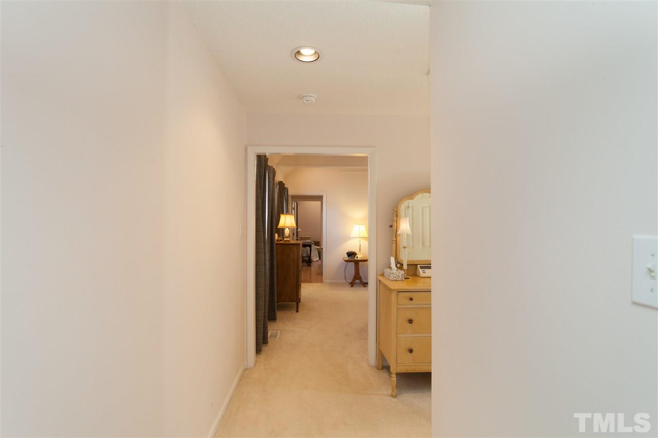 333 West Watson Road Benson, NC 27504 - Photo 14 of 25 a view of a hallway with a livingroom and a bathroom with a sink