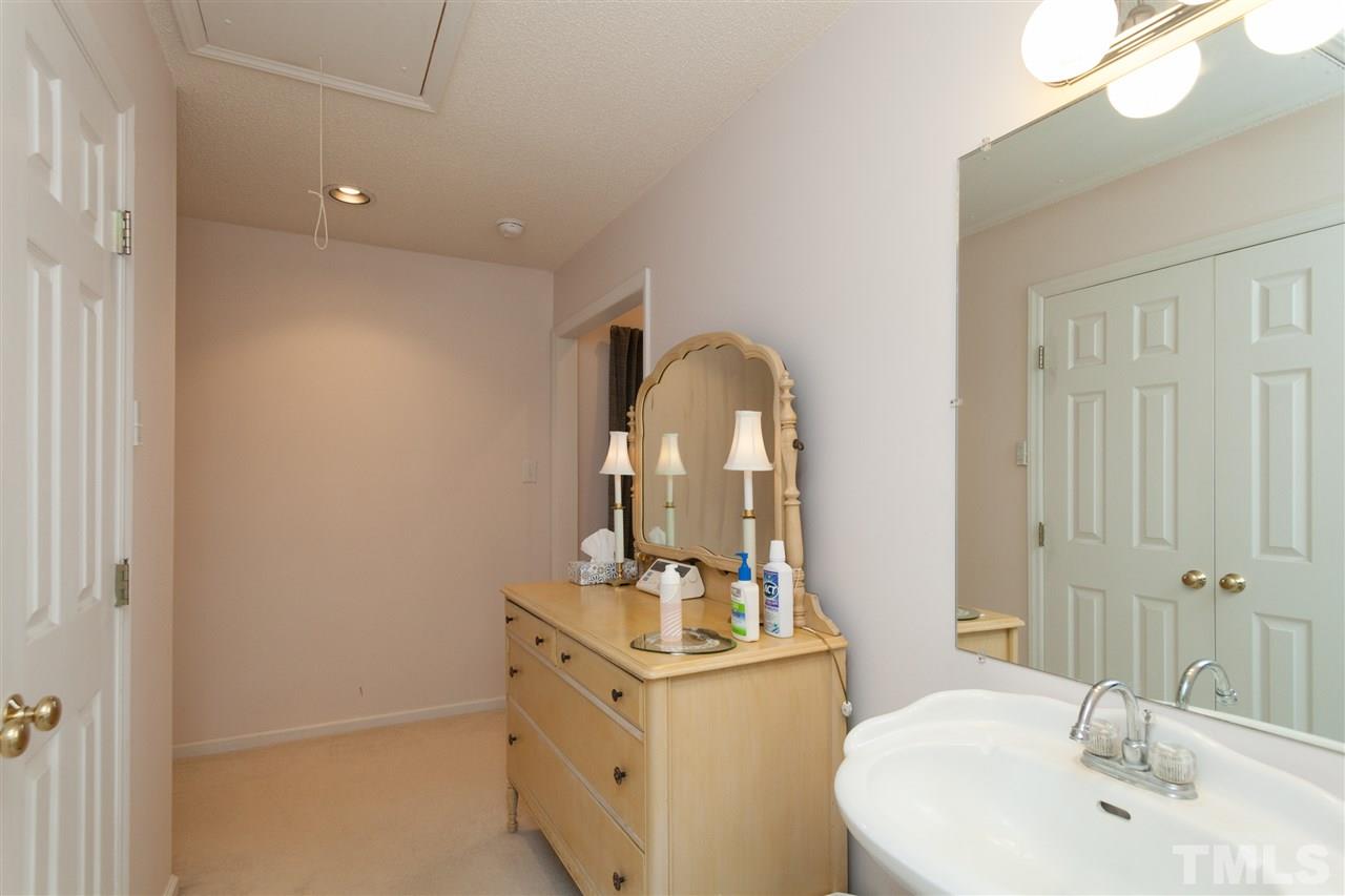 333 West Watson Road Benson, NC 27504 - Photo 17 of 25 a bathroom with a sink a toilet and mirror