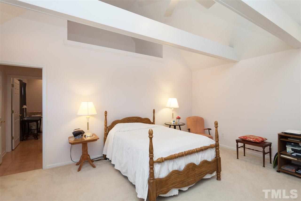 333 West Watson Road Benson, NC 27504 - Photo 18 of 25 a bedroom with a bed and a table in it