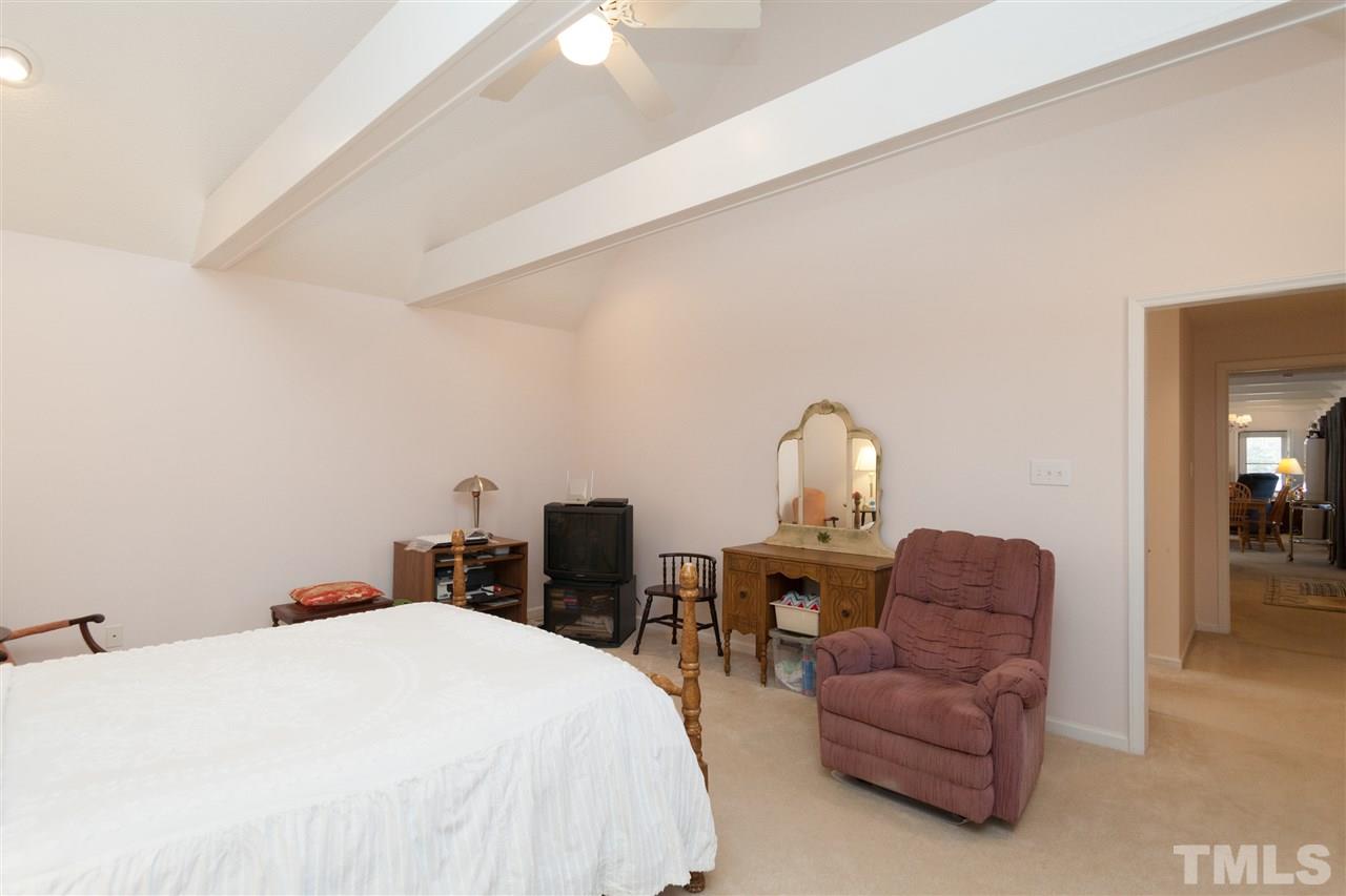 333 West Watson Road Benson, NC 27504 - Photo 20 of 25 a bedroom with a bed desk and chair