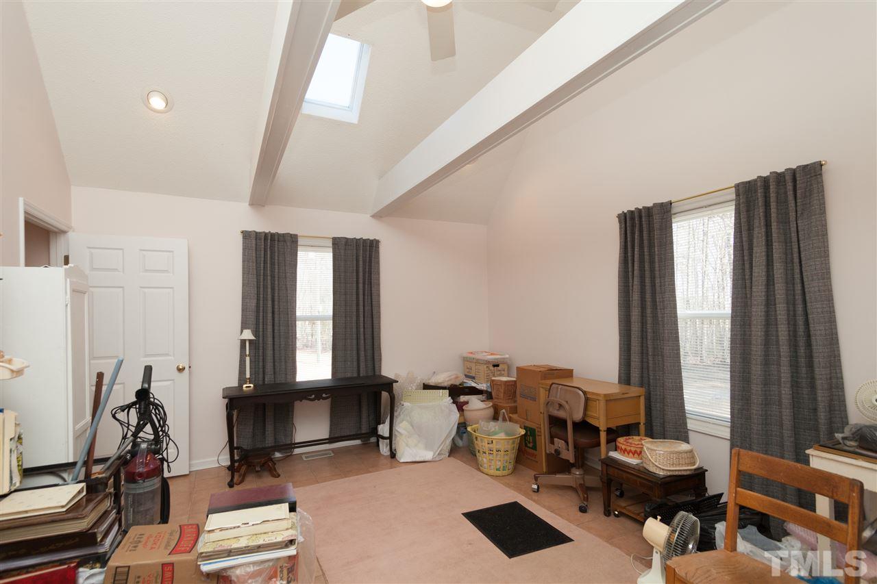 333 West Watson Road Benson, NC 27504 - Photo 22 of 25 a living room with furniture and large windows