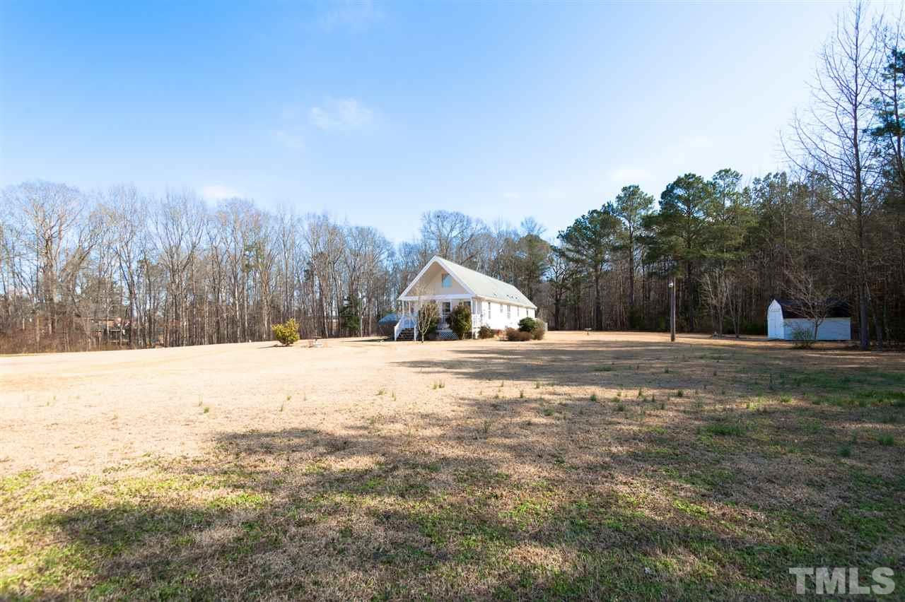 333 West Watson Road Benson, NC 27504 - Photo 4 of 25 a view of a yard with a tree