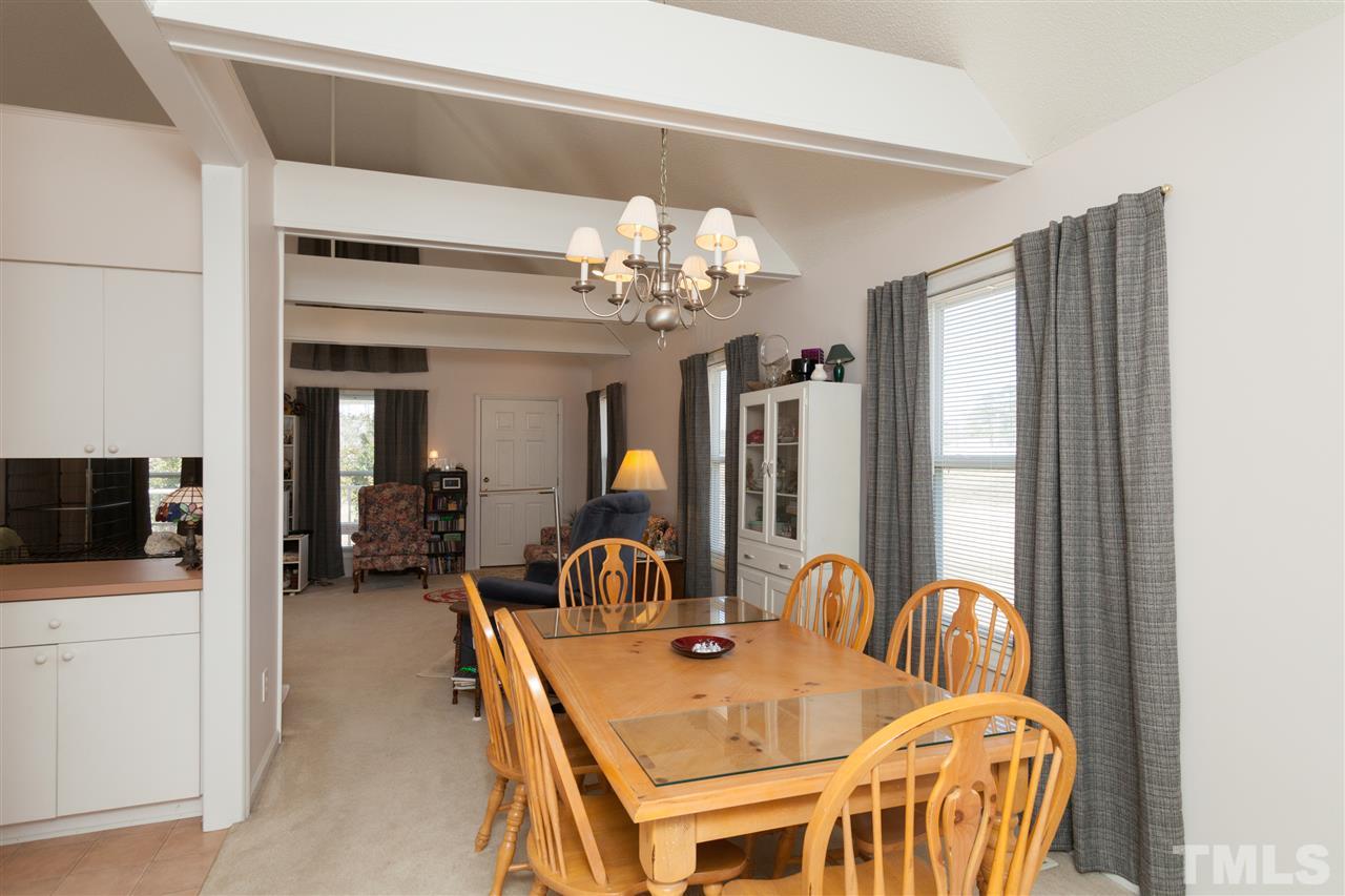 333 West Watson Road Benson, NC 27504 - Photo 9 of 25 a dining room with furniture and chandelier