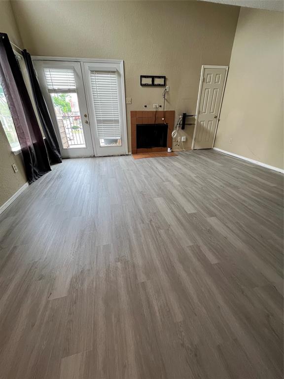 9811 Walnut Street, Unit 201 Dallas, TX 75243 - Photo 1 of 9 a view of a livingroom with furniture and wooden floor