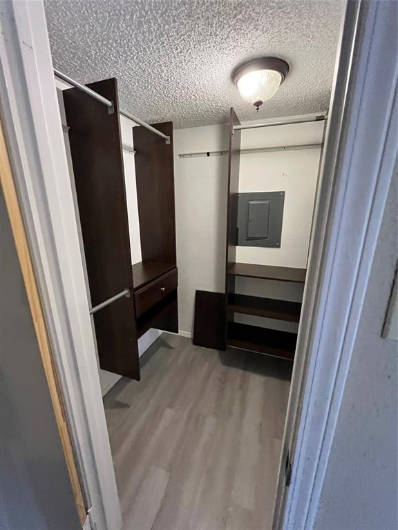 9811 Walnut Street, Unit 201 Dallas, TX 75243 - Photo 5 of 9 a view of walk in closet