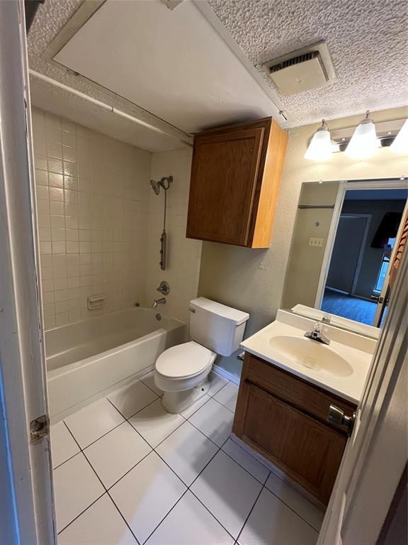 9811 Walnut Street, Unit 201 Dallas, TX 75243 - Photo 6 of 9 a bathroom with a sink mirror vanity and toilet