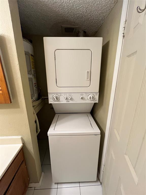 9811 Walnut Street, Unit 201 Dallas, TX 75243 - Photo 8 of 9 a utility room with dryer and washer