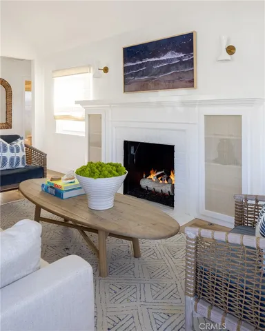 a living room with a fireplace and a table