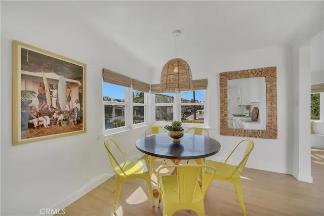 a view of a dining room with furniture and a table