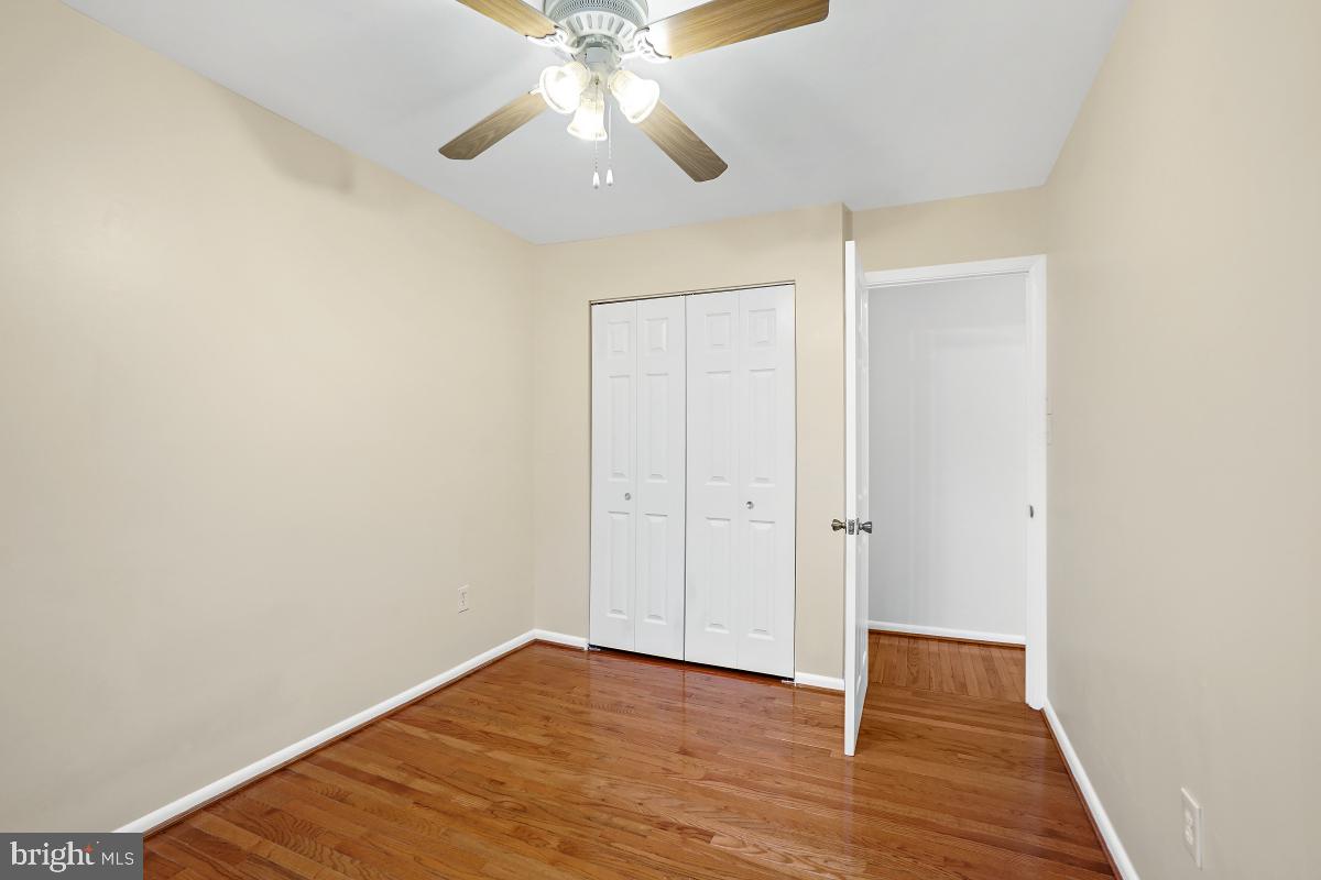 10867 Bucknell Drive, Unit 52 Silver Spring, MD 20902 - Photo 20 of 33 a view of an empty room with wooden floor