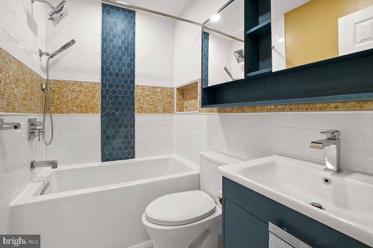 10867 Bucknell Drive, Unit 52 Silver Spring, MD 20902 - Photo 21 of 33 a bathroom with a sink a toilet and bathtub