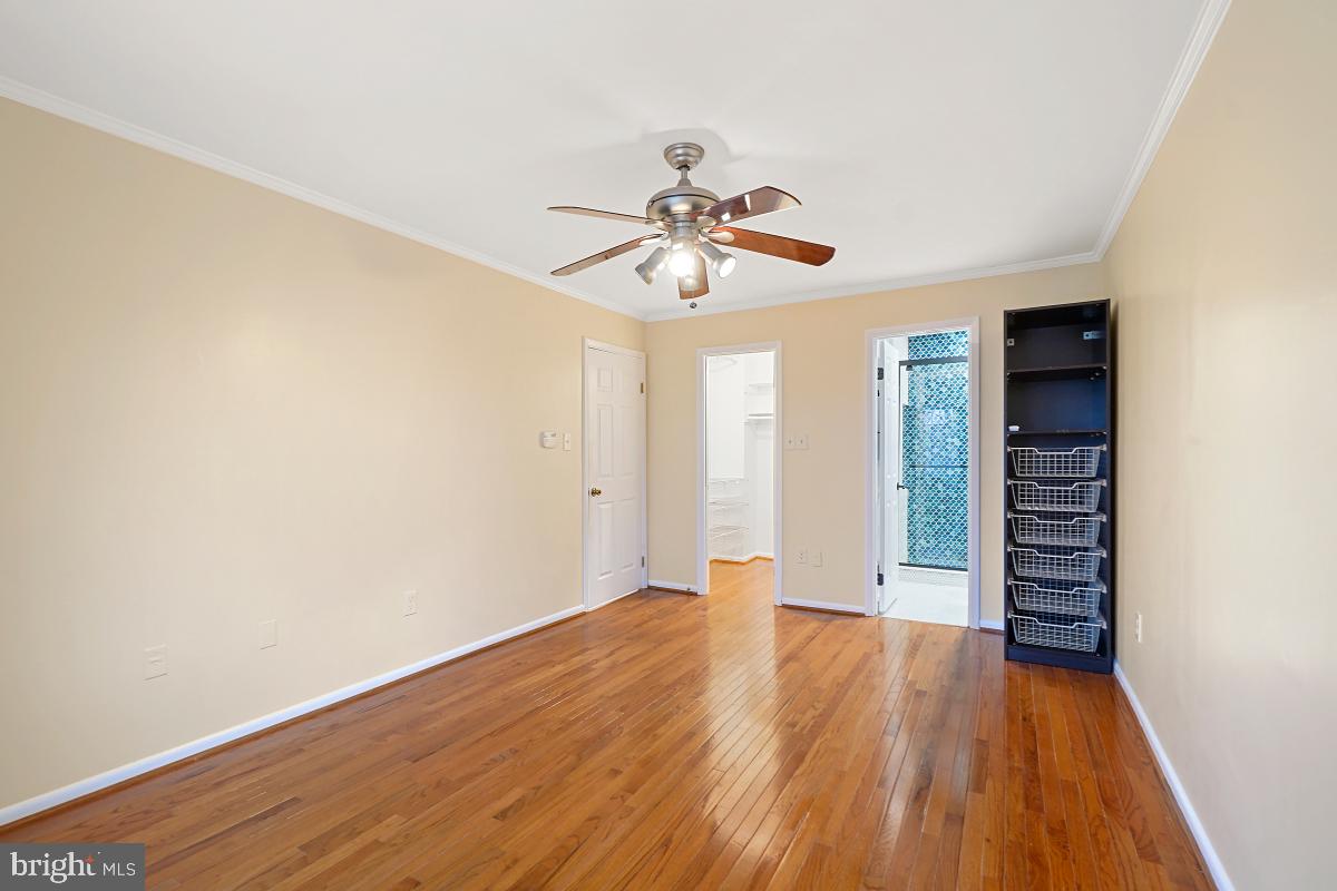 10867 Bucknell Drive, Unit 52 Silver Spring, MD 20902 - Photo 24 of 33 a view of room with hardwood floor and ceiling fan