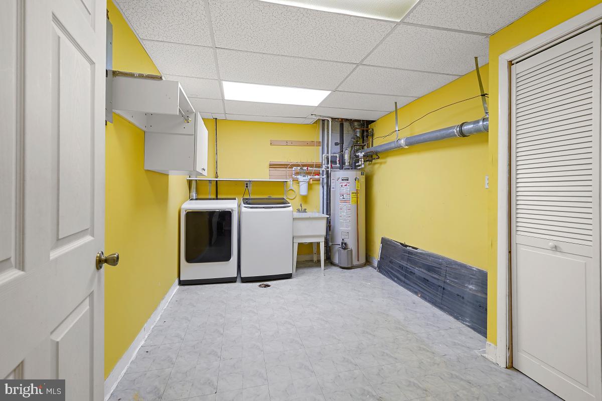 10867 Bucknell Drive, Unit 52 Silver Spring, MD 20902 - Photo 27 of 33 a view of a storage & utility room with washer and dryer