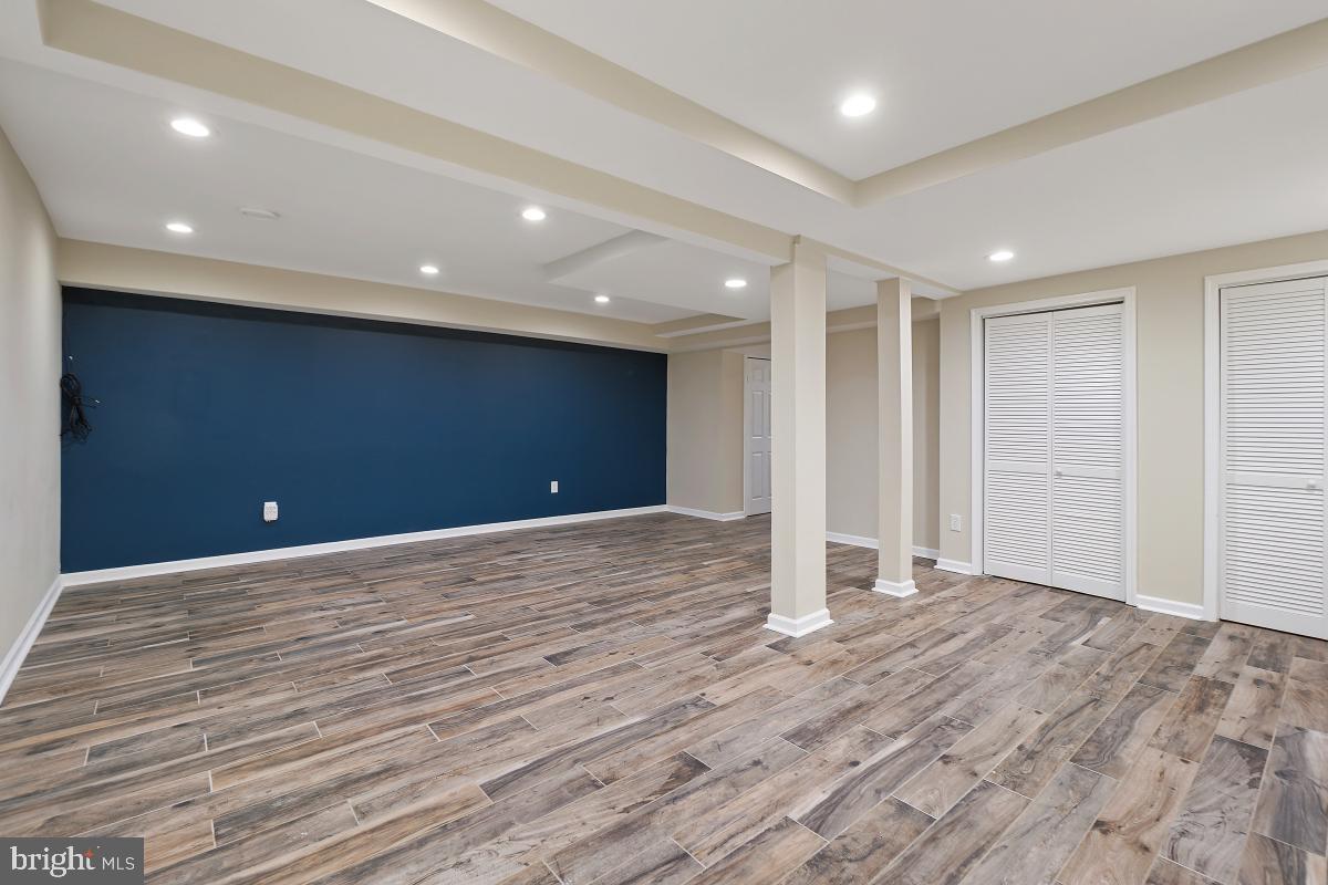 10867 Bucknell Drive, Unit 52 Silver Spring, MD 20902 - Photo 31 of 33 a view of an empty room with wooden floor
