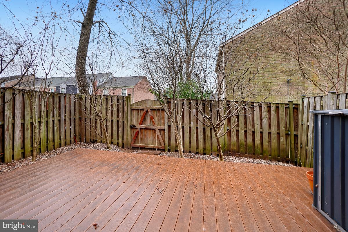10867 Bucknell Drive, Unit 52 Silver Spring, MD 20902 - Photo 32 of 33 a view of backyard with a wooden fence