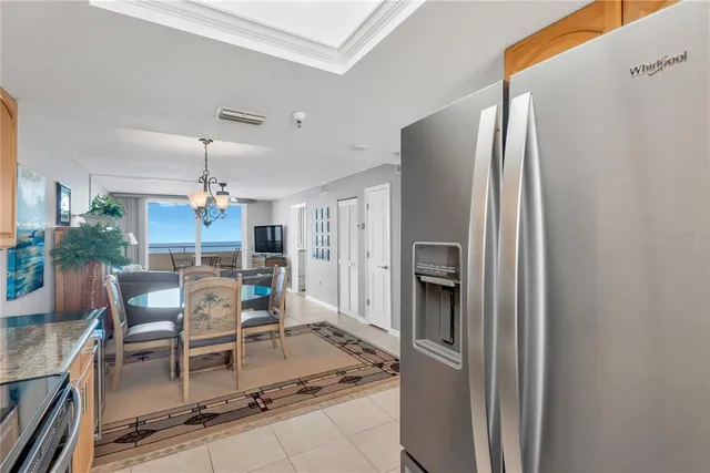 a kitchen with stainless steel appliances granite countertop a refrigerator and a stove