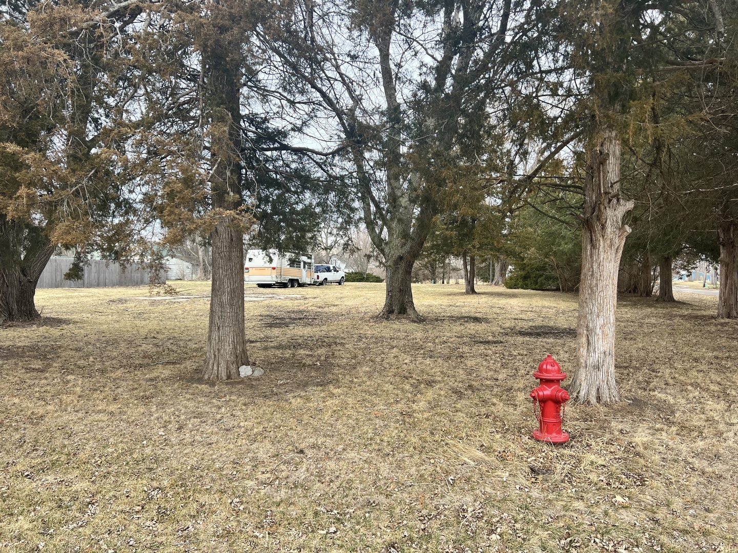 428 East 5th Avenue Rankin, IL 60960 - Photo 7 of 17 a sign board with tall trees