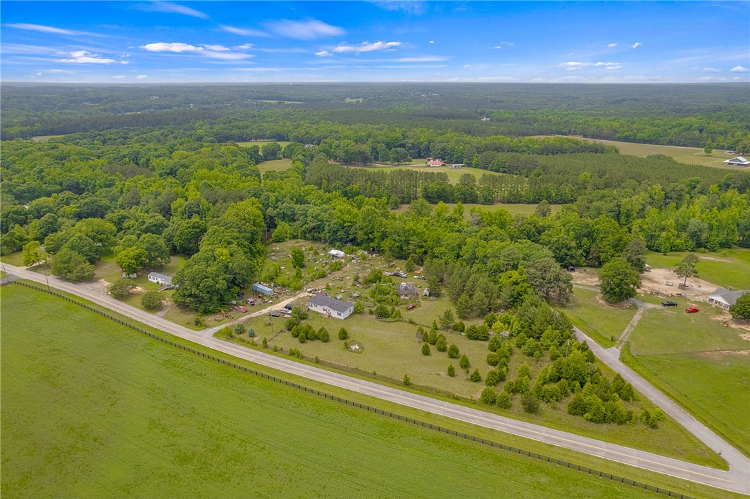 1549 Bethany Church Road Belton, SC 29627 - Photo 4 of 36 Sprawling acreage with a private residence, surrounded by lush woodlands and verdant fields.