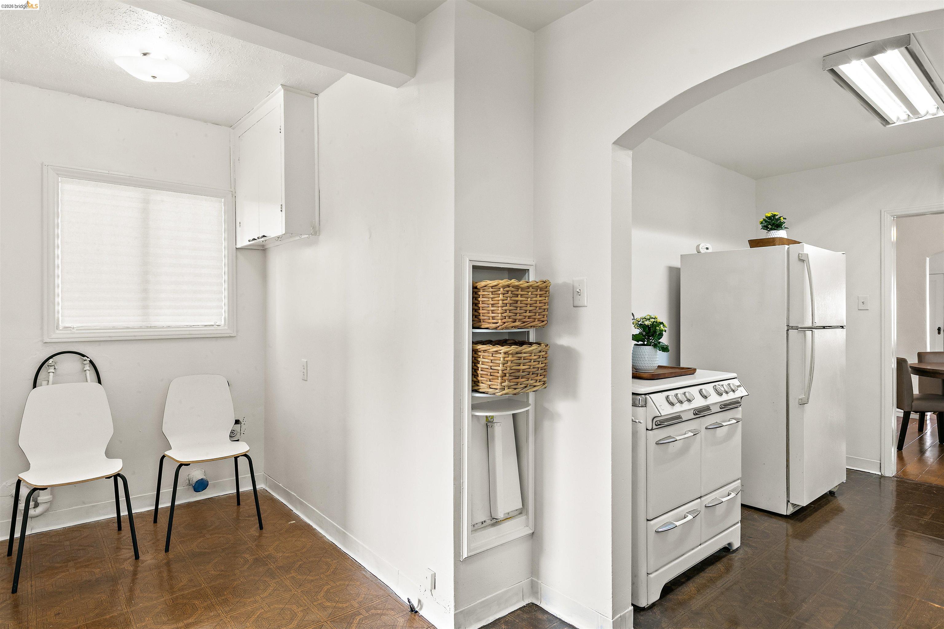 910 Pierce Street Albany, CA 94706 - Photo 10 of 44 a kitchen with stainless steel appliances a refrigerator a stove a dining table and chairs